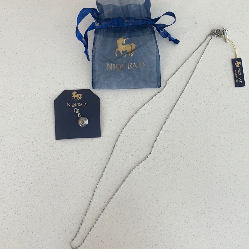 Niquead necklace and shell charm
